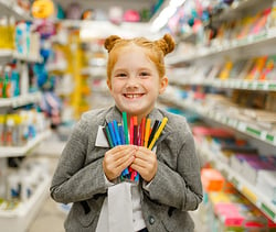 girl with school supplies