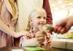 kids paying at store