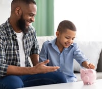 man and son with piggybank