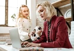 mom working with daughter wanting to play